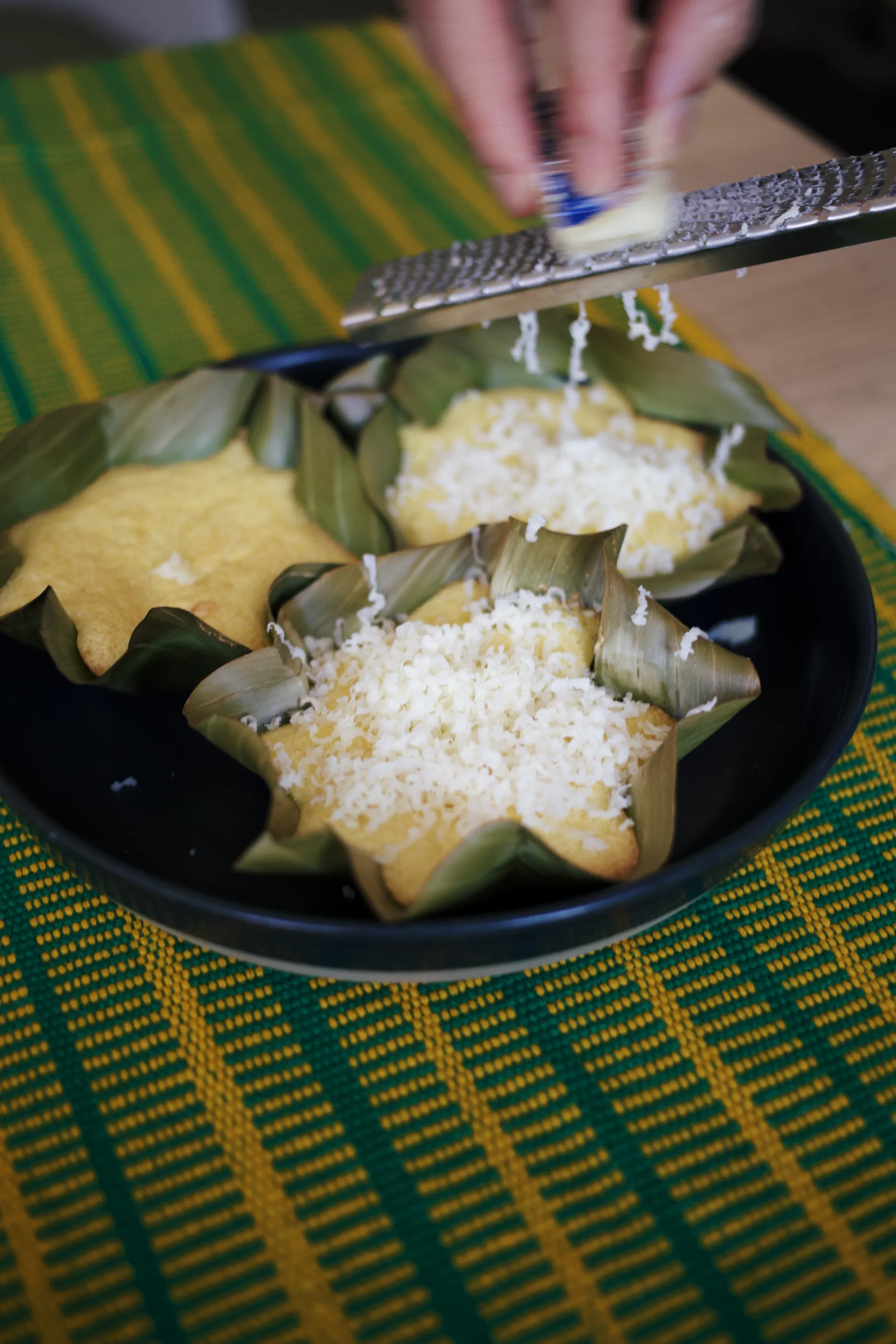 Drizzling honey over baked bibingka